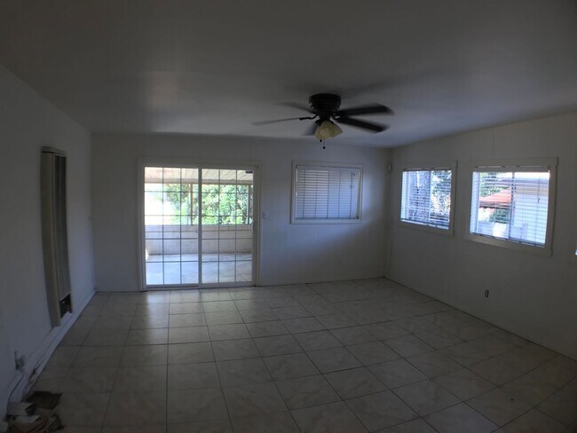 Building Photo - BEAUTIFUL WOOD FLOORS IN THIS- 5 BED 2 BATHROOM- Includes maid service