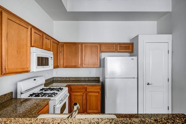 Building Photo - Second Story Condo with Open Floor Plan and Granite Counters