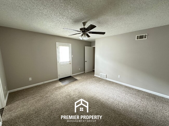 Building Photo - Quiet 3BR/2BA Cove Near Southwind | Soaring Ceilings & Floor-to-Ceiling Stone Fireplace