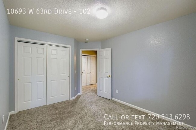 Building Photo - 10693 W 63rd Dr