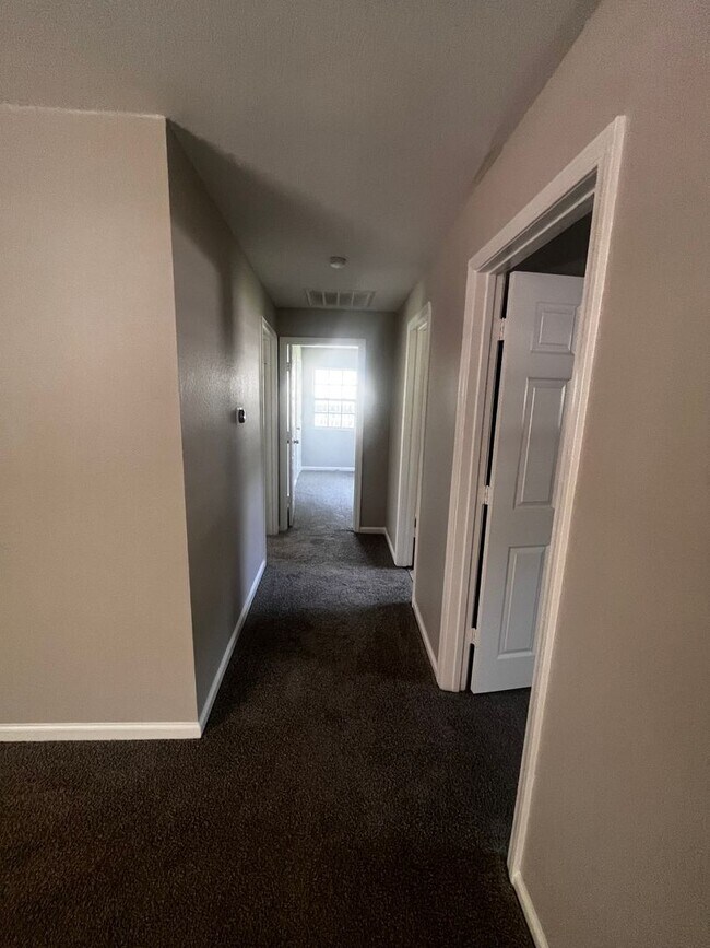 Building Photo - Freshly updated home with privacy fence in...