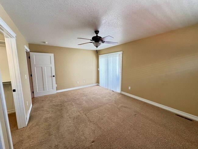 Building Photo - 4 BEDROOM, 3 BATHROOM TWINHOME WITH 2 CAR ATTACHED GARAGE IN NORTH CHEYENNE