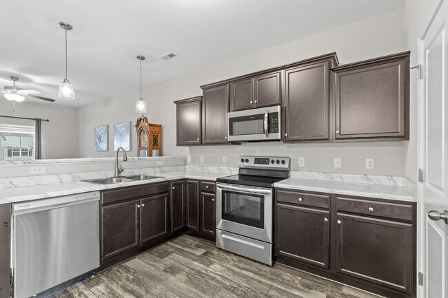 Building Photo - Marshall Farms Beauty with Dual Suites & Open-Concept Living