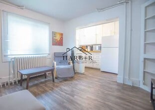 Building Photo - Modern Minimalism: Efficient 1-BR in a Top-Tier Location