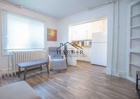 Building Photo - Modern Minimalism: Efficient 1-BR in a Top-Tier Location