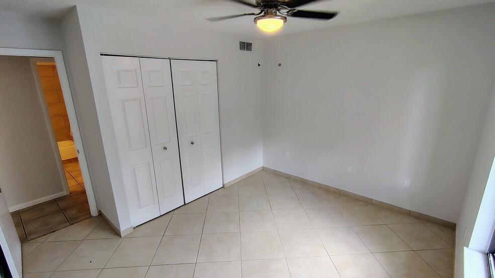 2nd bedroom also w/view of preserve, new ceiling fan; across from 2nd bath - 1353 Pine Ridge Cir E