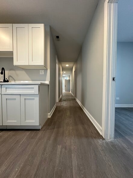 Kitchen sink area with a view down the hallway - 5653 S May St