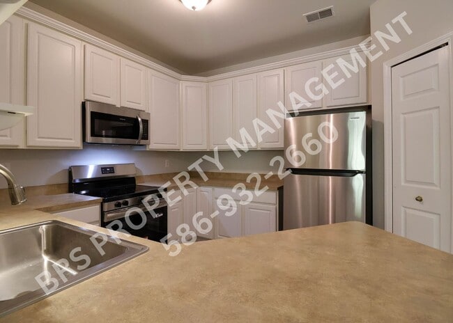 Building Photo - Move-In Ready 2BR Condo with Covered Garage in Harrison Township