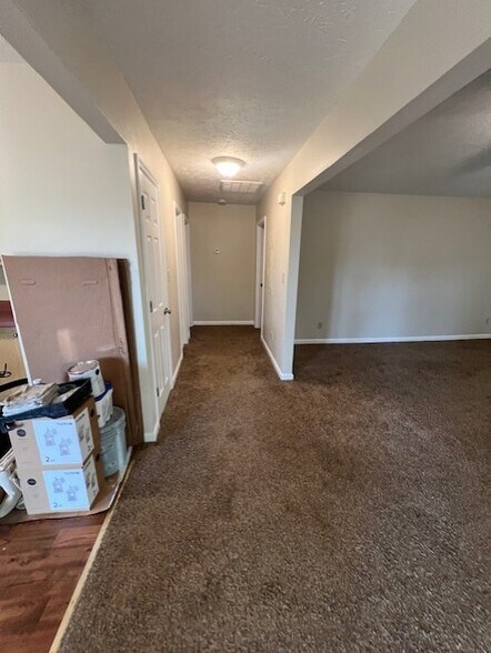 Hallway looking from living area towards bedrooms and bathroom - 100 Twin Acres Dr