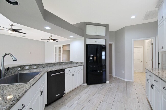 Building Photo - Annual rental: Spacious 3BR/2BA Creekwood Home with Office, Screened Lanai, EV Charger & Resort-S...