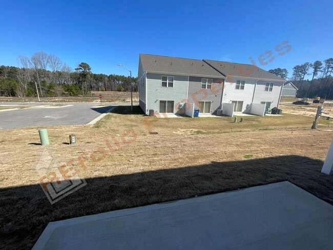 Building Photo - Brand New 3 Bedroom 1-Car Garage Townhome ...
