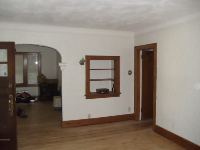 LIVING ROOM SHOWING BOOK CASE - 832 Paris Ave