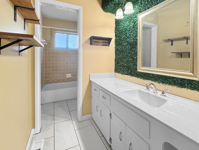 Building Photo - Spacious 3 Bed/3 Bath Midtown Home with Oversized Garage, Large Deck, and Storage Shed