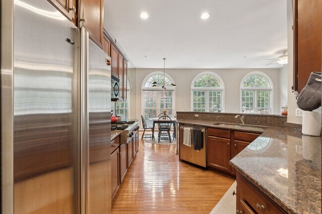 Building Photo - Discover this stunning four-level townhous...