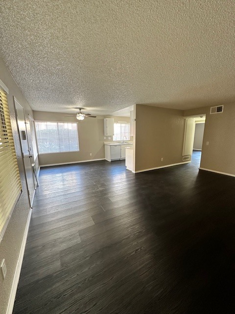View from corner of the living room towards dining area/kitchen - 7385 Lariat Pl