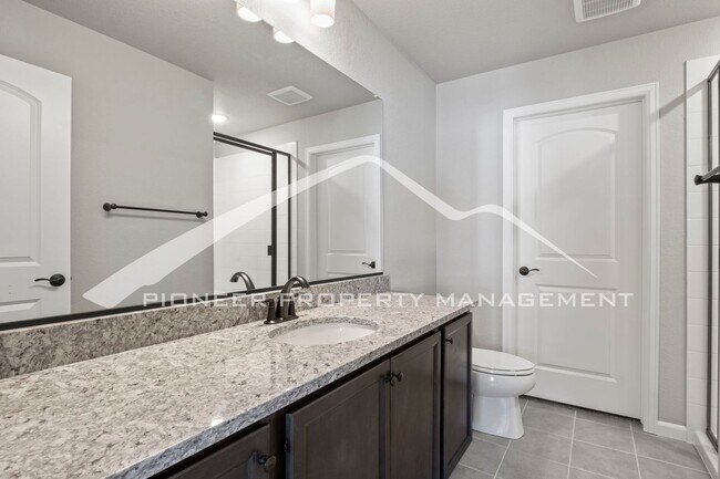 Building Photo - Contemporary Townhome in the Vibrant Interquest Low Maintenance Community with 2 car garage, Wash...