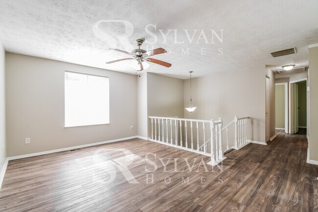 Building Photo - The living is easy in this 4 bedroom, 2 ba...