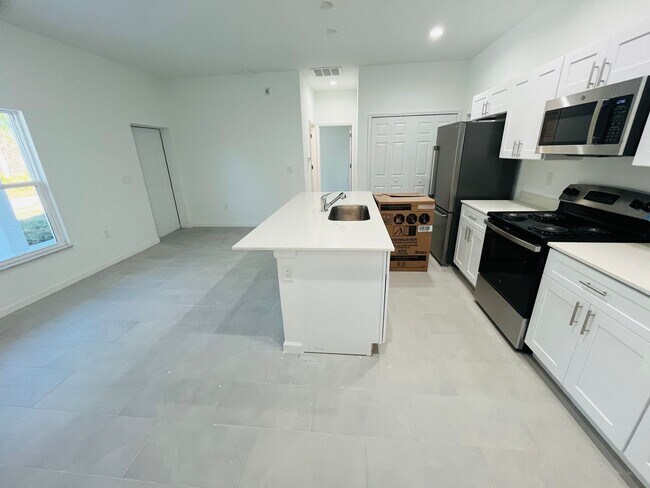 Building Photo - BRAND NEW ONE BEDROOM, ONE BATH-ONE CAR GARAGE- SOUTH LEHIGH ACRES