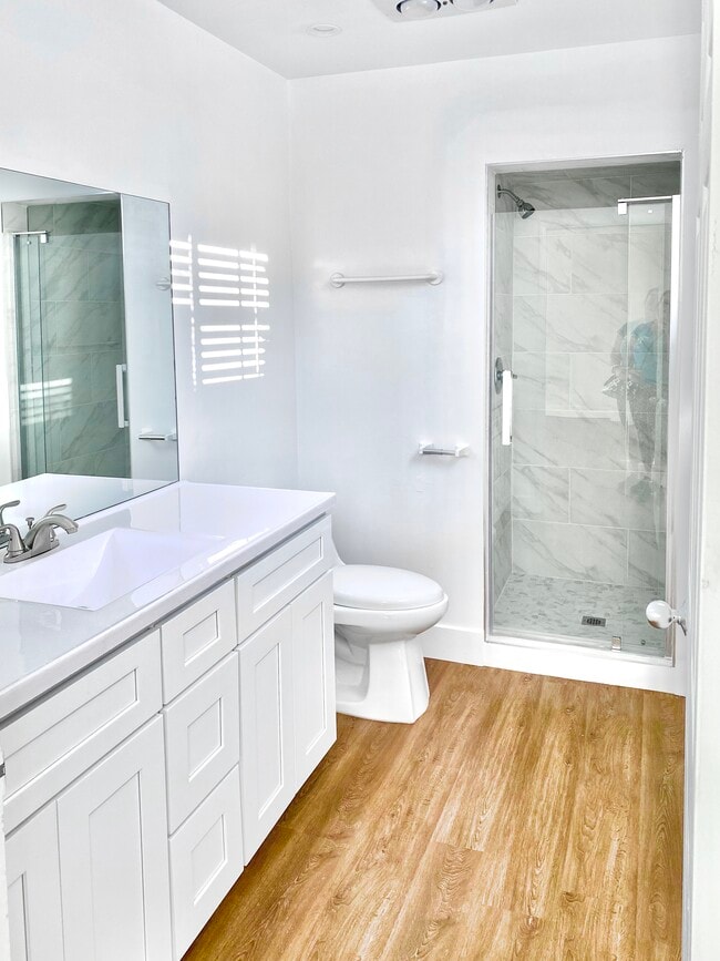 master bath with marble tile shower - 2456 Arizona Ave