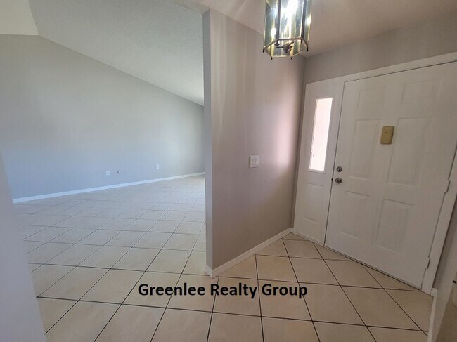 Building Photo - Relax by the water in this spacious 2-bedroom home with a 2-car garage, nestled in the highly des...