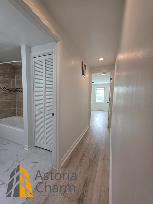Building Photo - 3 Bedroom End Unit with Finished Basement and Fenced Yard on E 28th Street