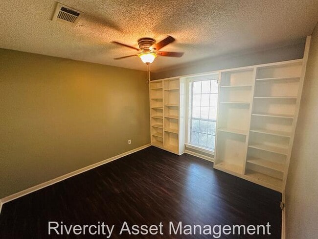 Building Photo - charming three-bedroom, two-full-bath resi...