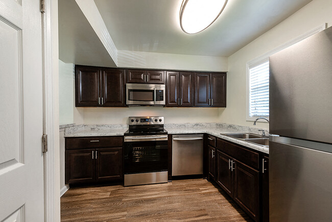 Kitchen with Stainless Steel Appliances - Fords Pointe Apartments and Townhomes