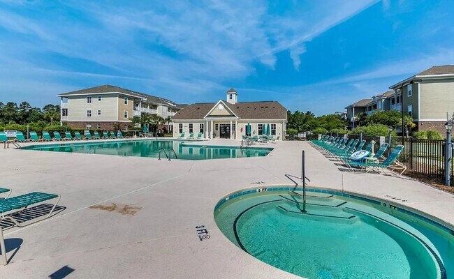 Building Photo - Relax and Unwind in this Spacious End-Unit...