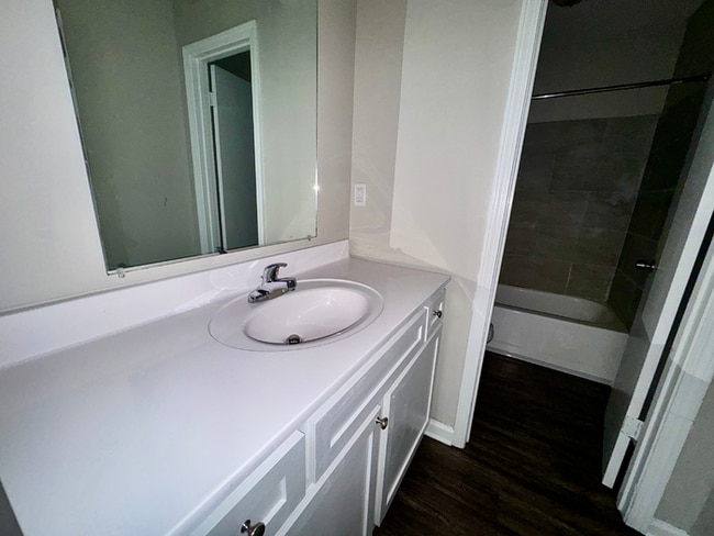 Building Photo - Charming 3BR/2BA Near Southwind | Soaring Vaulted Ceilings, Brick Fireplace & Fenced Yard