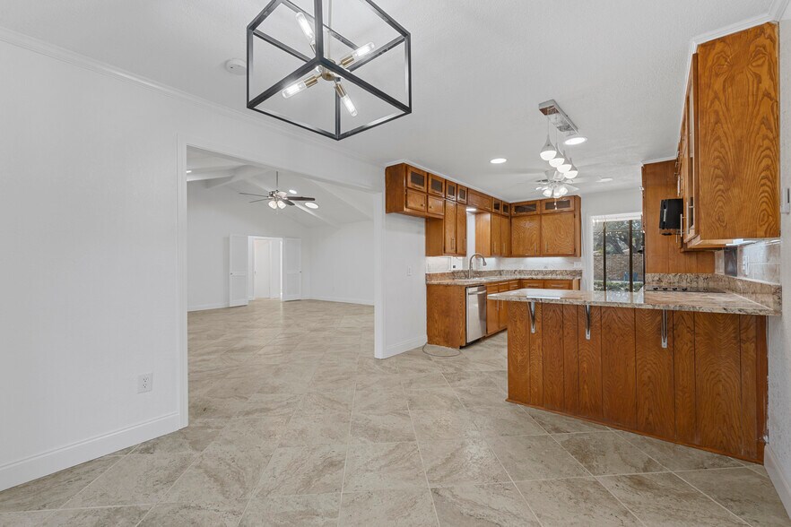 kitchen opening to main living area - 7105 Fish Pond Rd