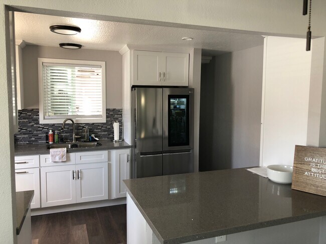 Kitchen from Dining Room, hallway to laundry and back yard. - 428 Hamilton St