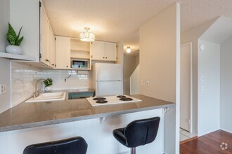 Building Photo - 2 bedroom / 1 1/2 bath / 2 parking condo i...