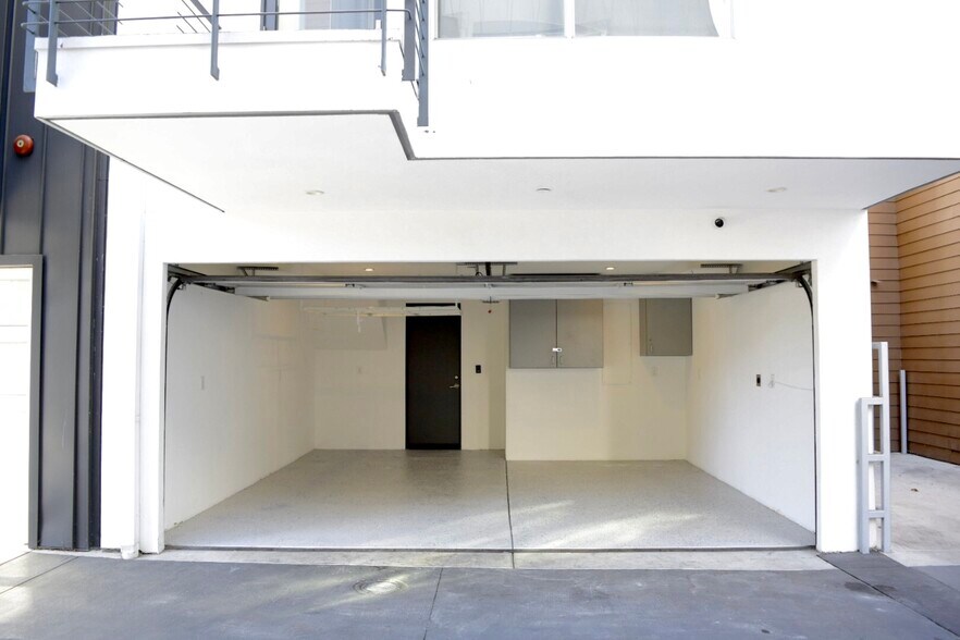 2 Car Garage (with EV charger) fits a regular size car (e.g. Honda CRV) and a small compact car - 7197 Formosa Fusion Ct