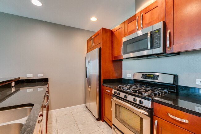 Building Photo - Iconic Strip-View Luxury | Elegant 1BR + Den High-Rise Residence