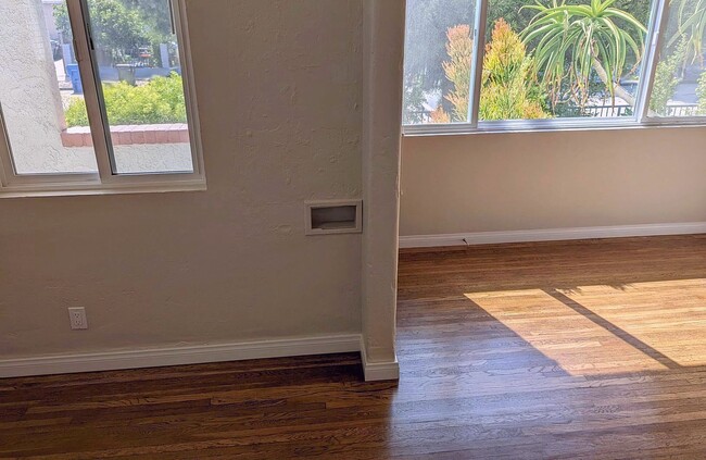 Open the blinds when you want to get natural light and see the greenery! - 1830 S Curson Ave