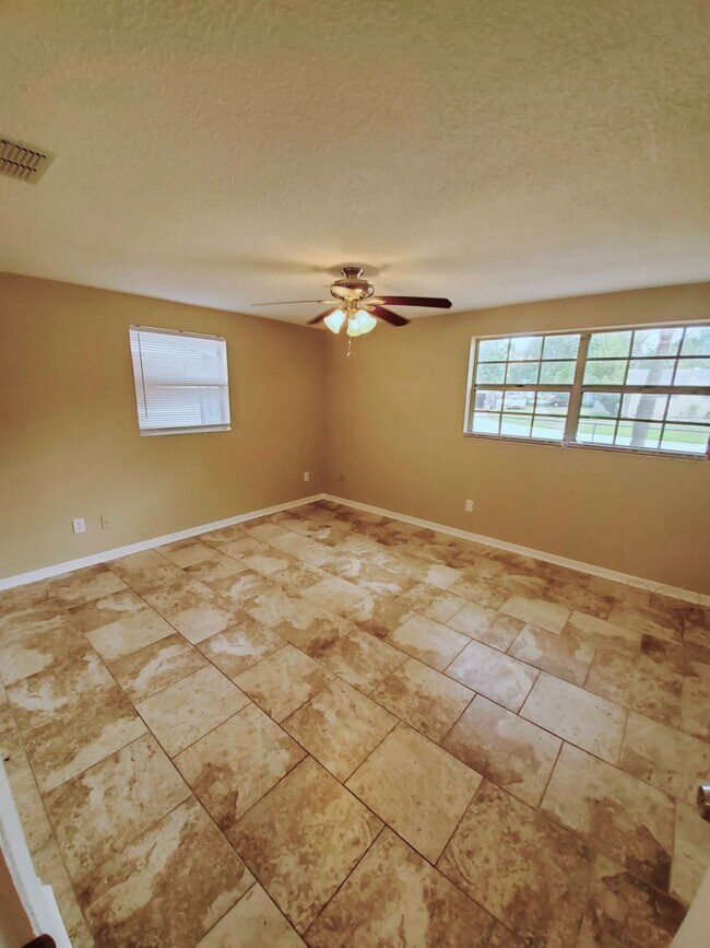 Building Photo - Three bedroom one and a half bathroom house with large yard space