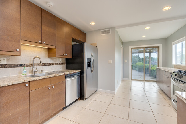 Recessed lighting and large windows brighten up the space - 211 Farview Drive