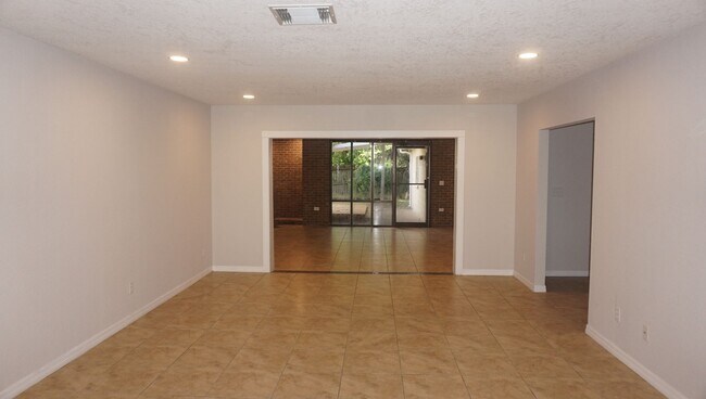 Building Photo - Four Bed - Three Bath - Large Storage Area...
