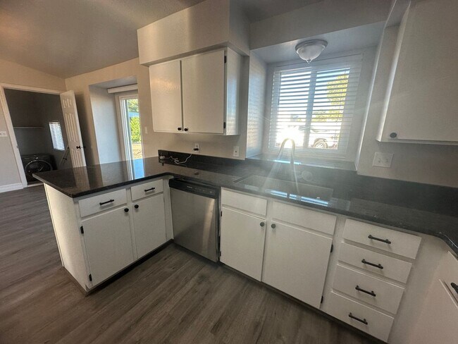 Building Photo - Quiet neighborhood, 3 bedroom, 2 bath home, huge front patio/deck, RV parking!