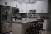 Building Photo - Comfortable 4BR/2BA Home with Yard & Parki...