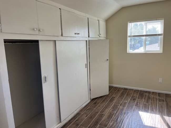 Master Bedroom: Large and inviting with a spacious closet and a newly updated en-suite bathroom. - 945 E 3rd St