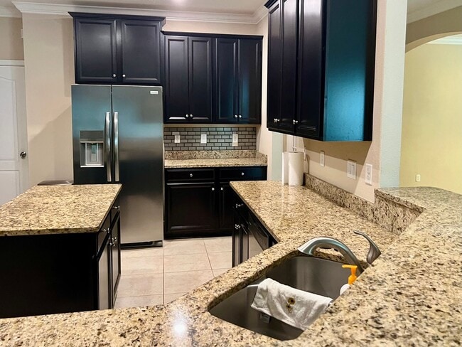 Building Photo - Spacious 5-Bedroom Home with Lawn Care Included!