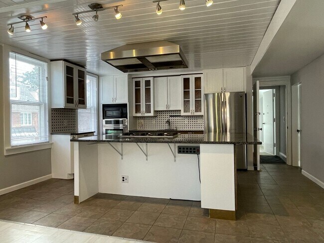 Building Photo - Small pets are welcome with an additional ...