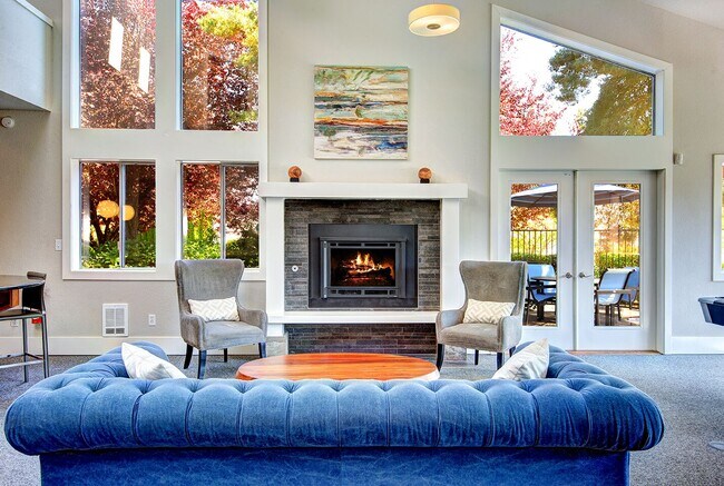 The Reserve at Bucklin Hill clubhouse with sofa and fireplace - The Reserve at Bucklin Hill