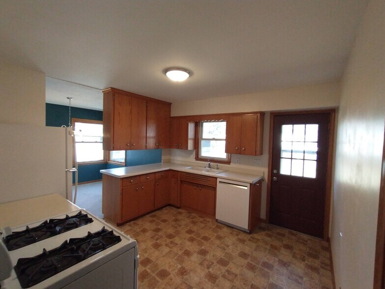 Kitchen on main floor (door leads to backyard patio) - 2163 Randy Ave