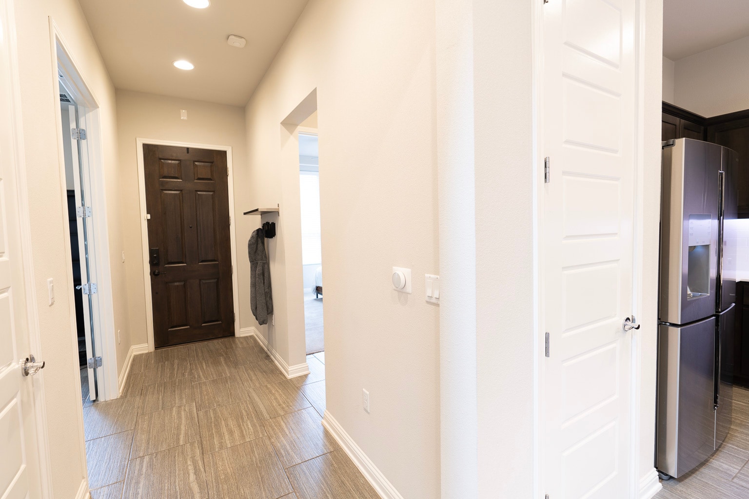Entryway with video doorbell, keyless entry, and peep-hole - 1711 Arcilla St
