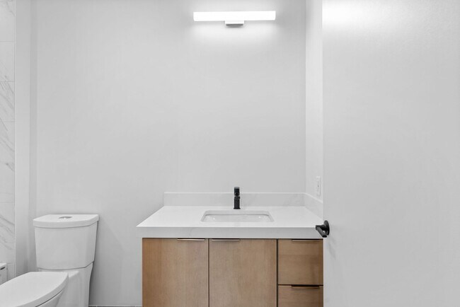 Building Photo - 2 Bedroom Corner-Unit with Wooded Balcony ...