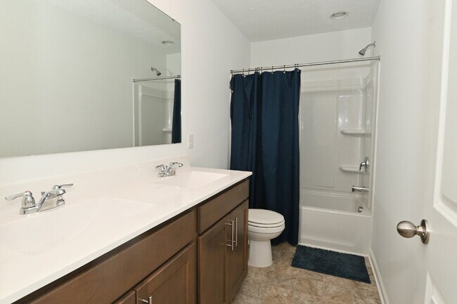 Building Photo - "Spacious 5-Bedroom Retreat with Luxurious Quartz Countertops & Fireplace on Deerberg Drive!"