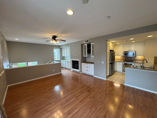 Building Photo - Sleek 2-Bed with a Den/Office + Flex Corner Condo with Attached Tandem Garage