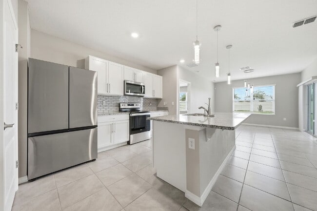 Building Photo - Three Bedroom, 2 Bathroom single family home with 2 Car Garage.